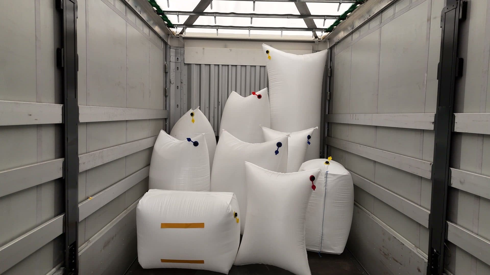 Block, pillow, and tube-style dunnage bags with color-coded inflation valves.