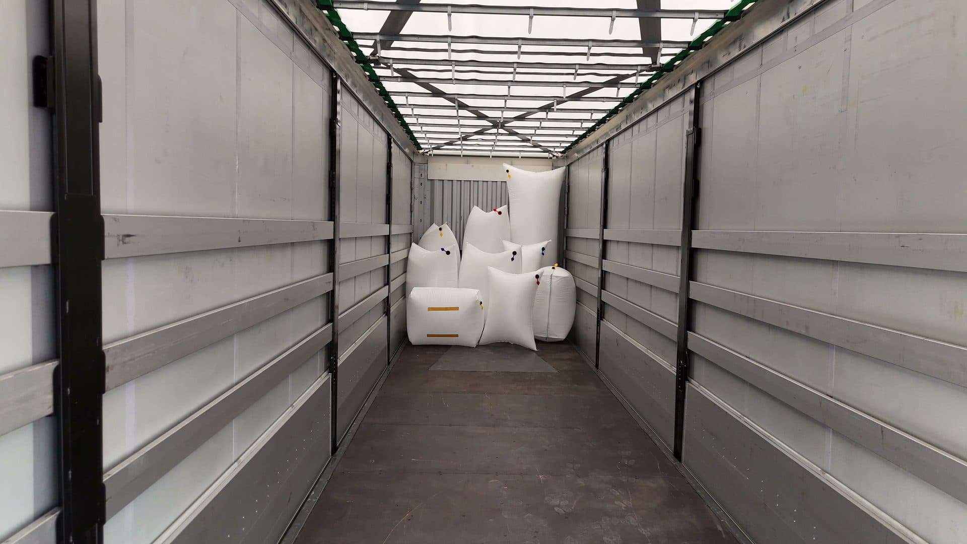A range of dunnage bag sizes staged inside an empty trailer.